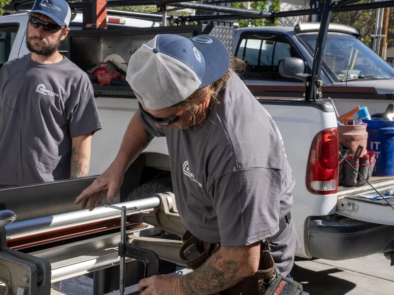 Two of our crew fabricating trim on a tailgate-mounted brake